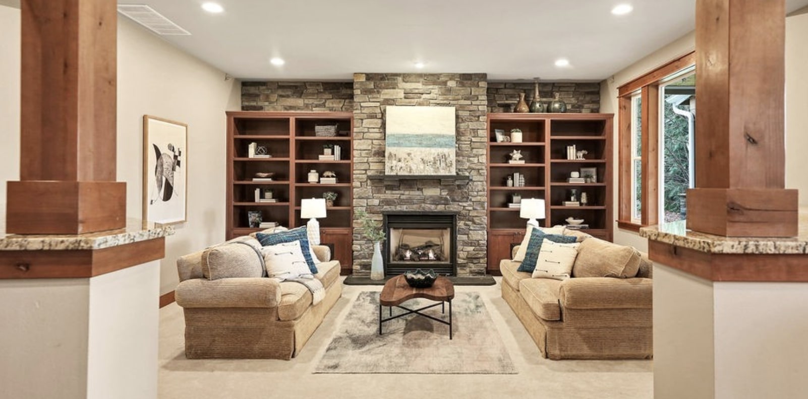 The cozy great room features a cozy fireside seating arrangement