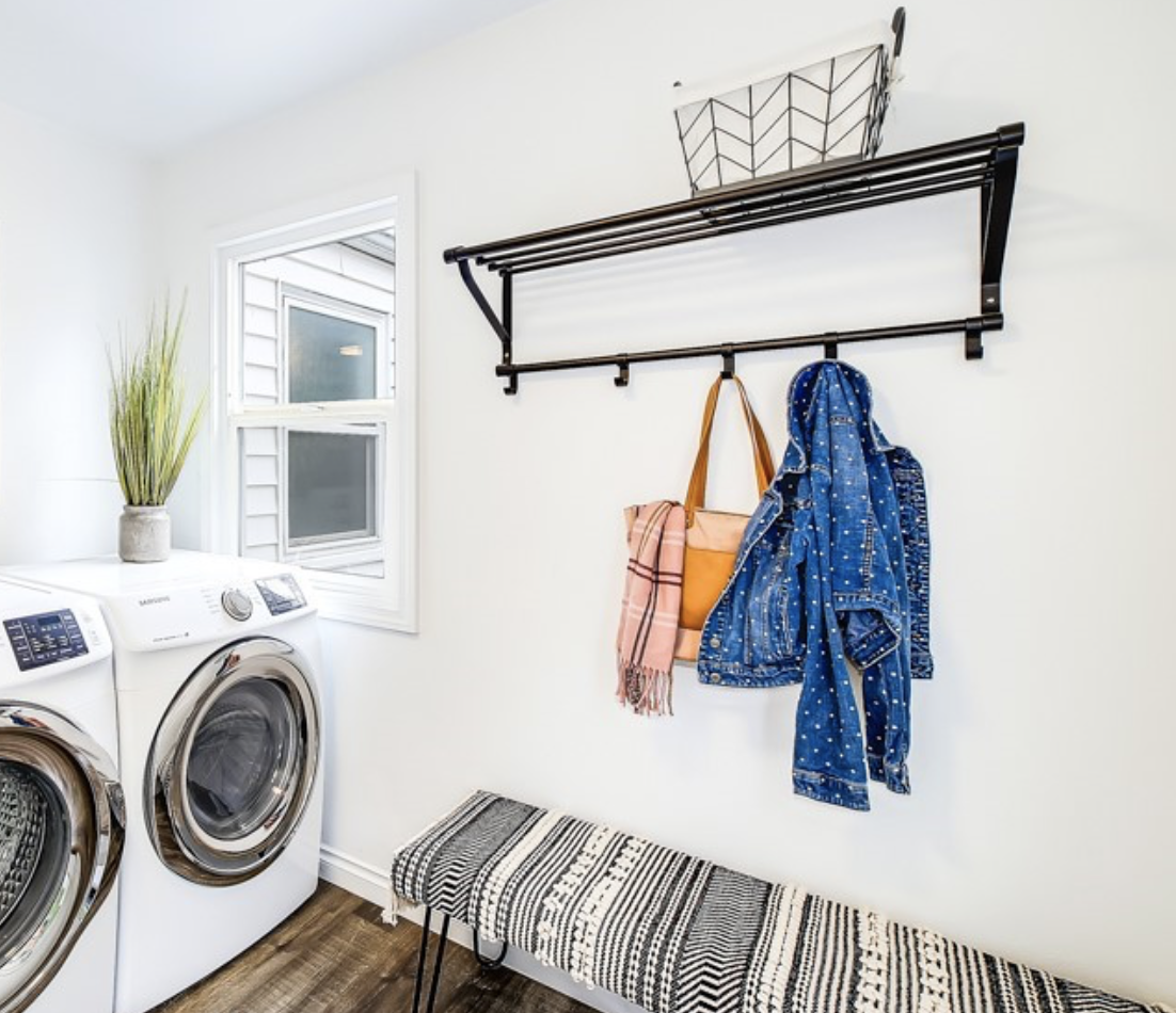 Sweet laundry space and mudroom with boho vibes