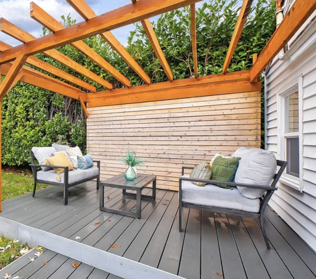 Trellised private back deck with modern eclectic style