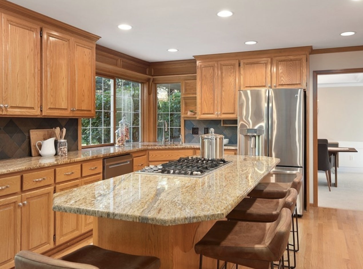 Warm wood and granite tones in the kitchen